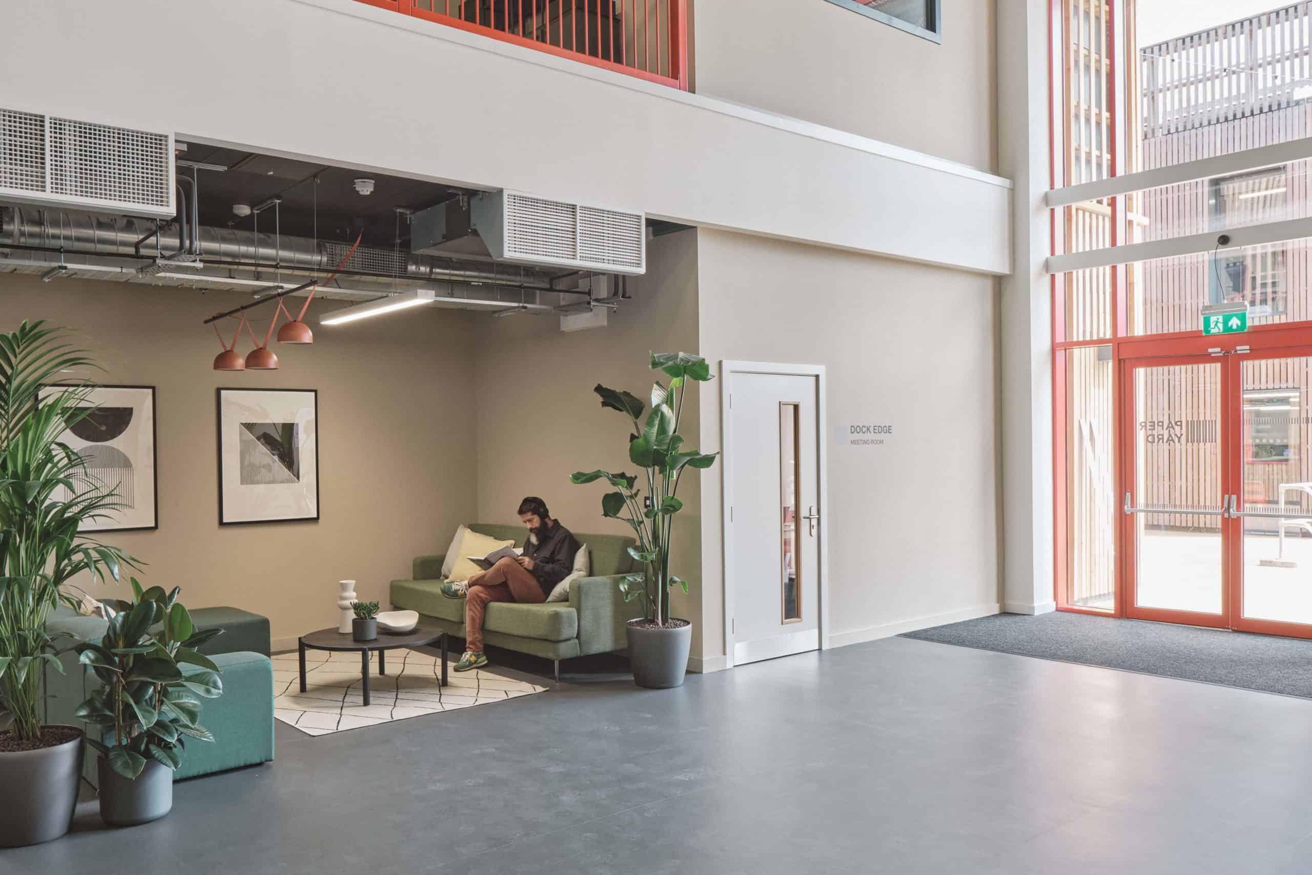 Inside commercial modular building for The Paper Yard. Seating area with natural light and tall ceilings. 